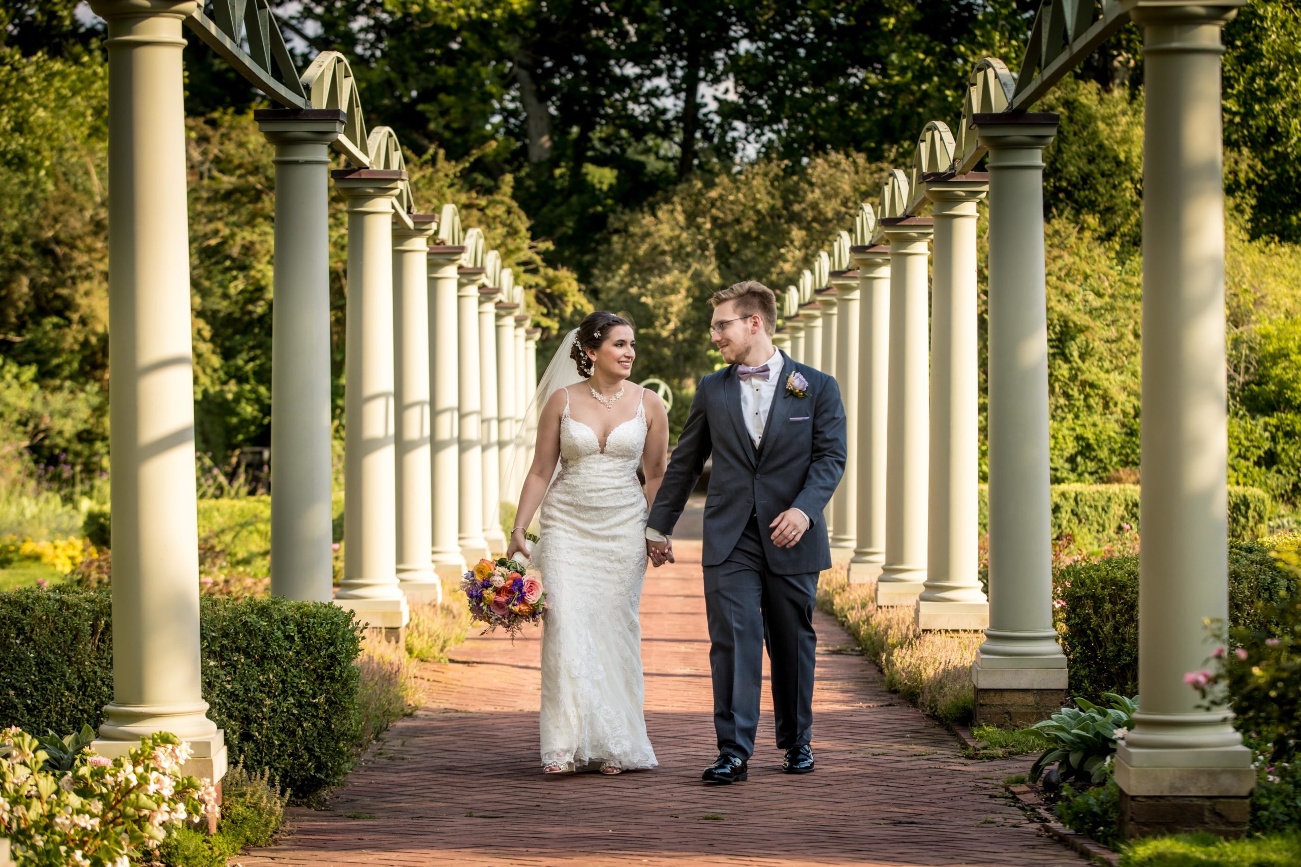 Maxson_McLoughlin meadow brook - Mike Staff Productions bride and groom walking in meadow brook garden