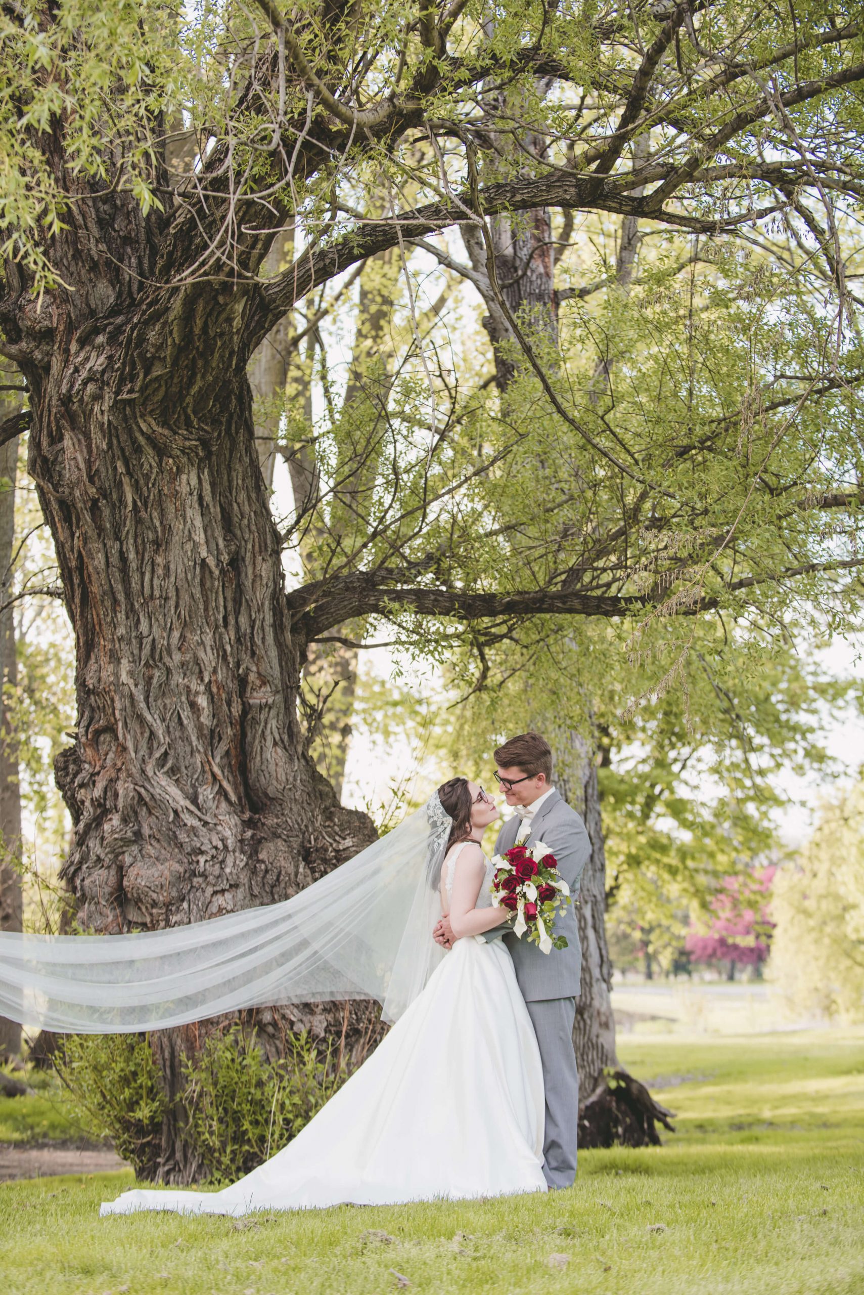 wedding photography bride and groom wedding veil flowing