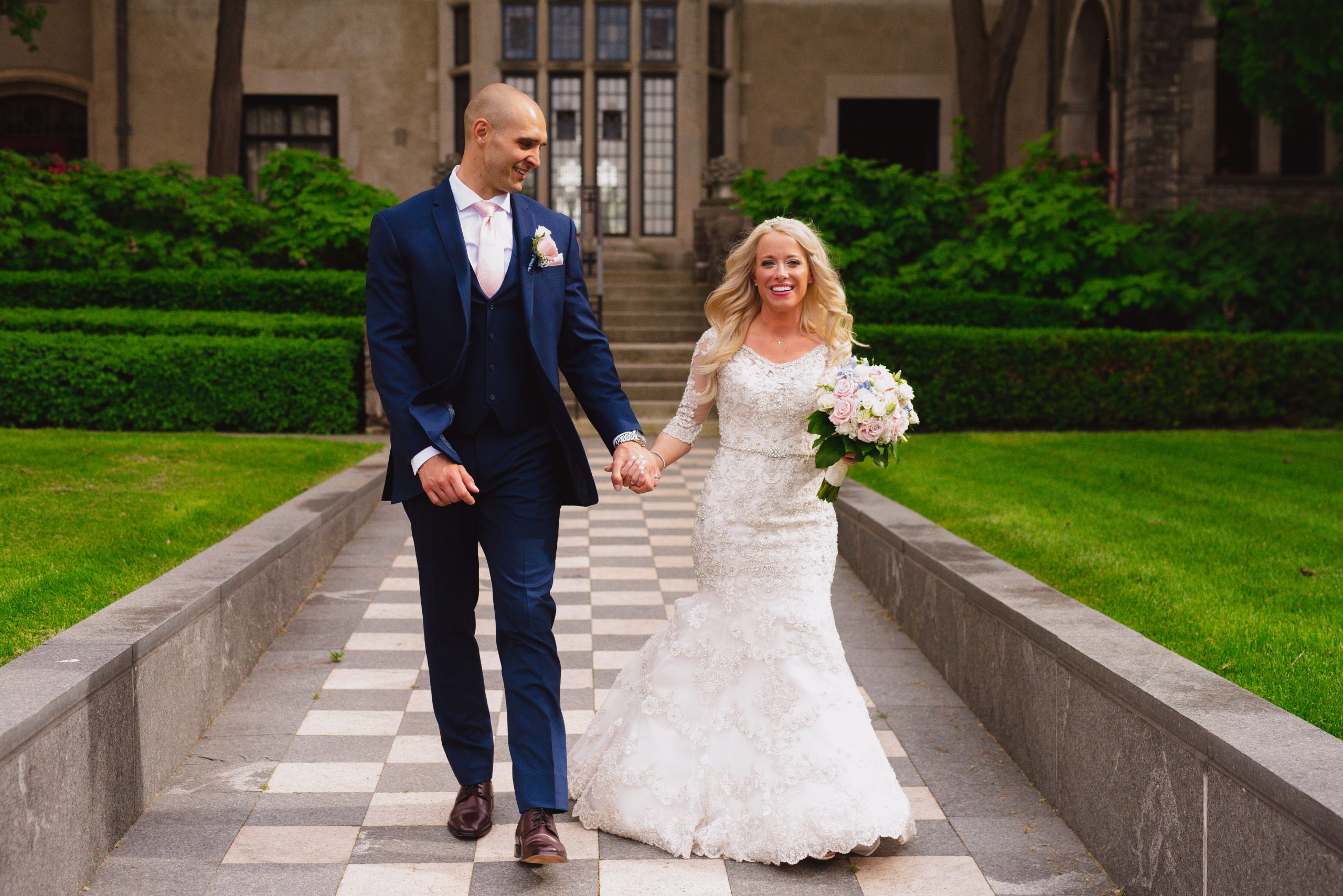 Real Detroit Wedding of Heather & John - Mike Staff Productions bride and groom walking outside church