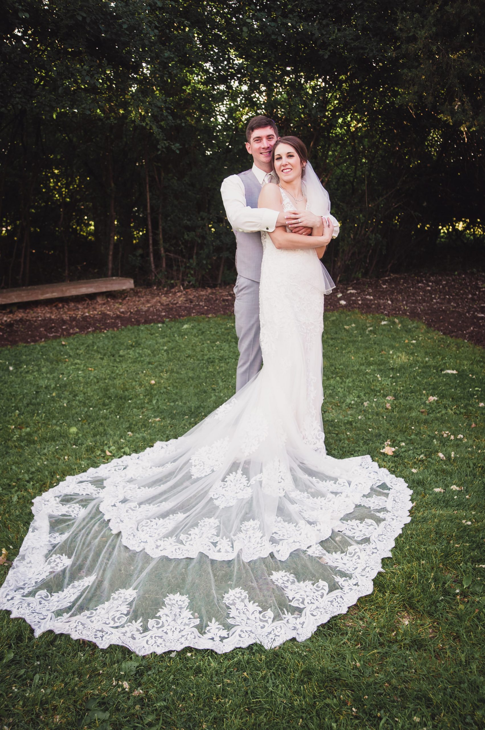 The Real Detroit Wedding of Sara and Jeffrey - Mike Staff Productions groom holding bride from behind
