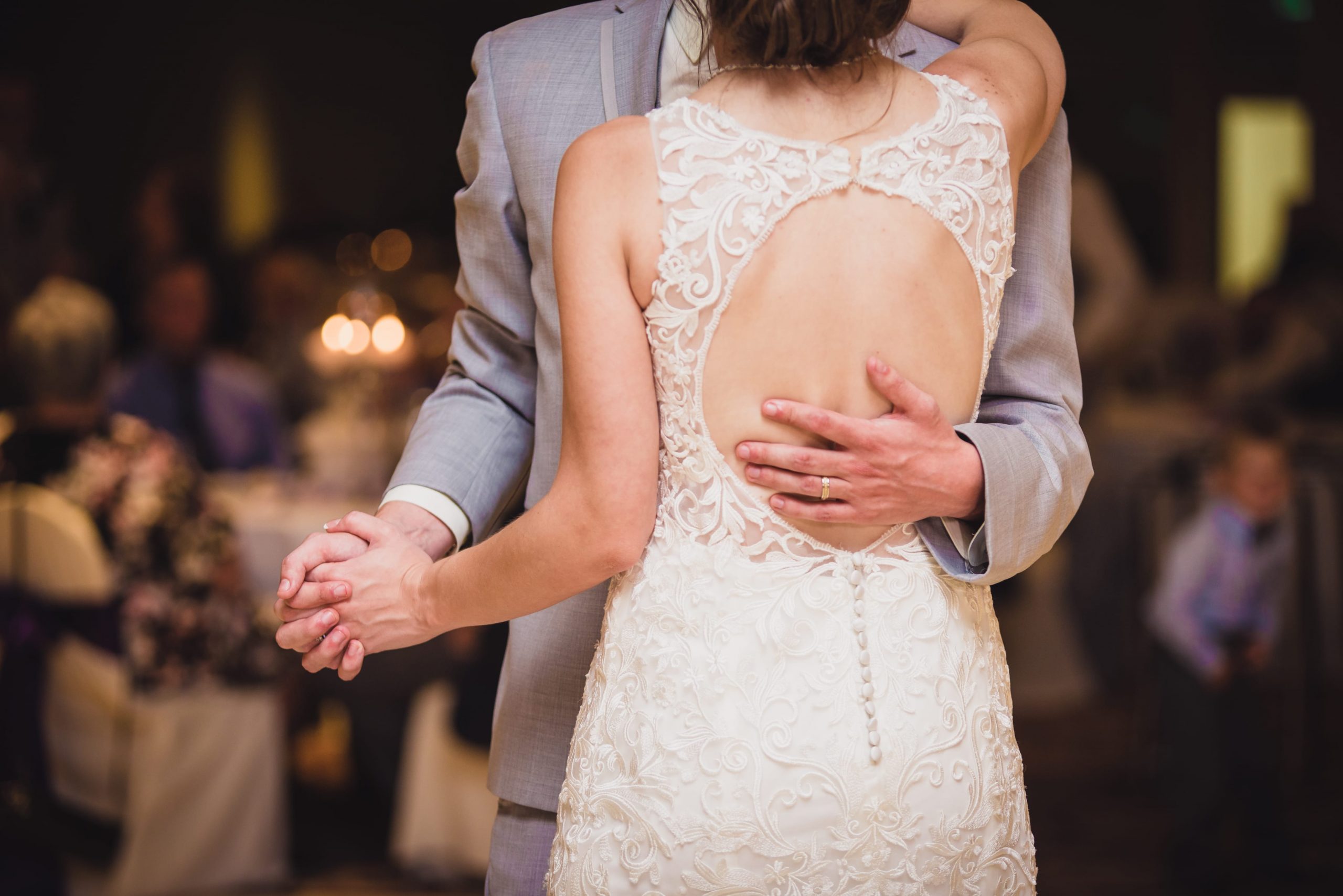 The Real Detroit Wedding of Sara and Jeffrey - Mike Staff Productions bride and groom dancing, with groom's hand on bride's back