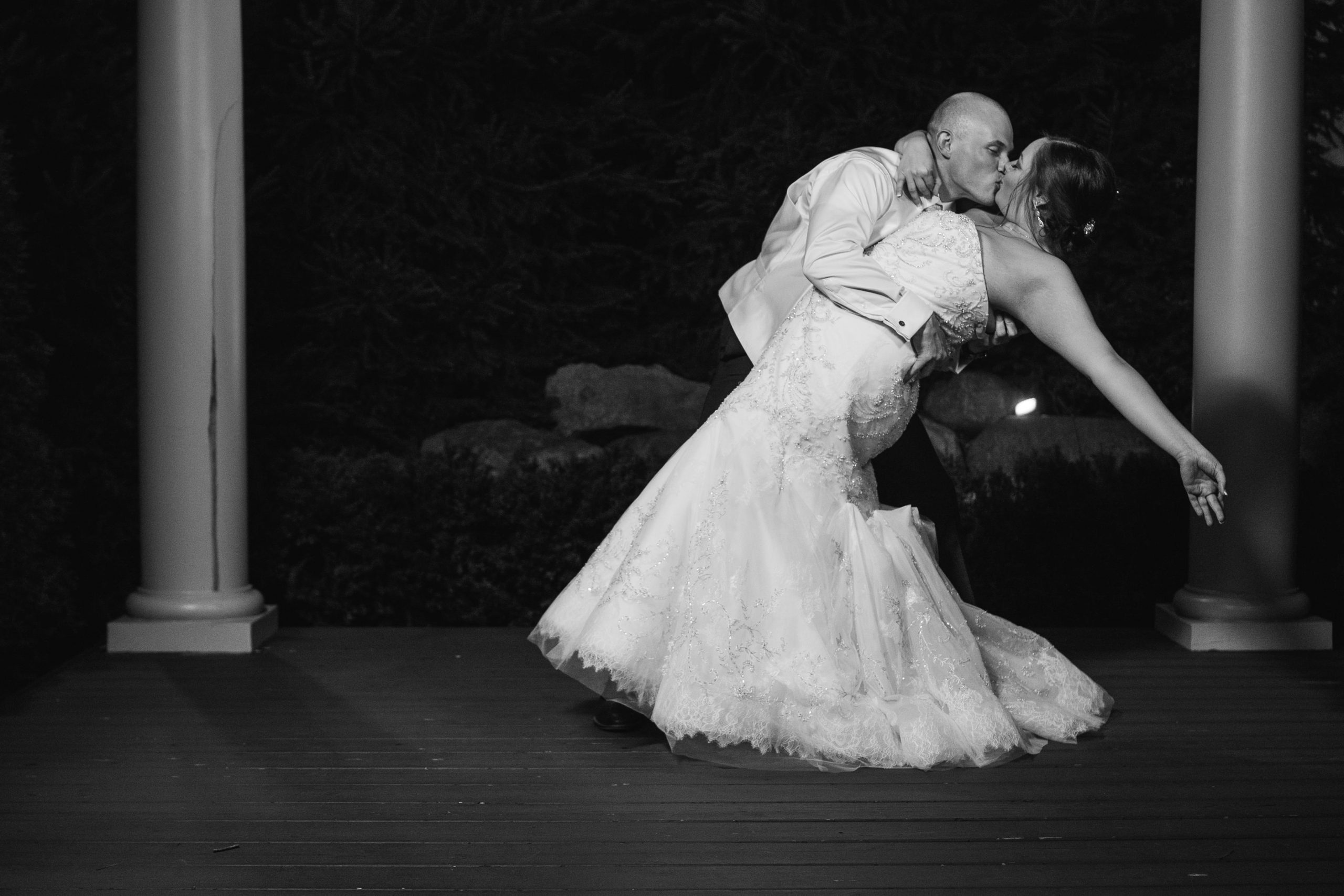 Real Detroit Wedding - Mike Staff Productions bride and groom kissing during evening romantics