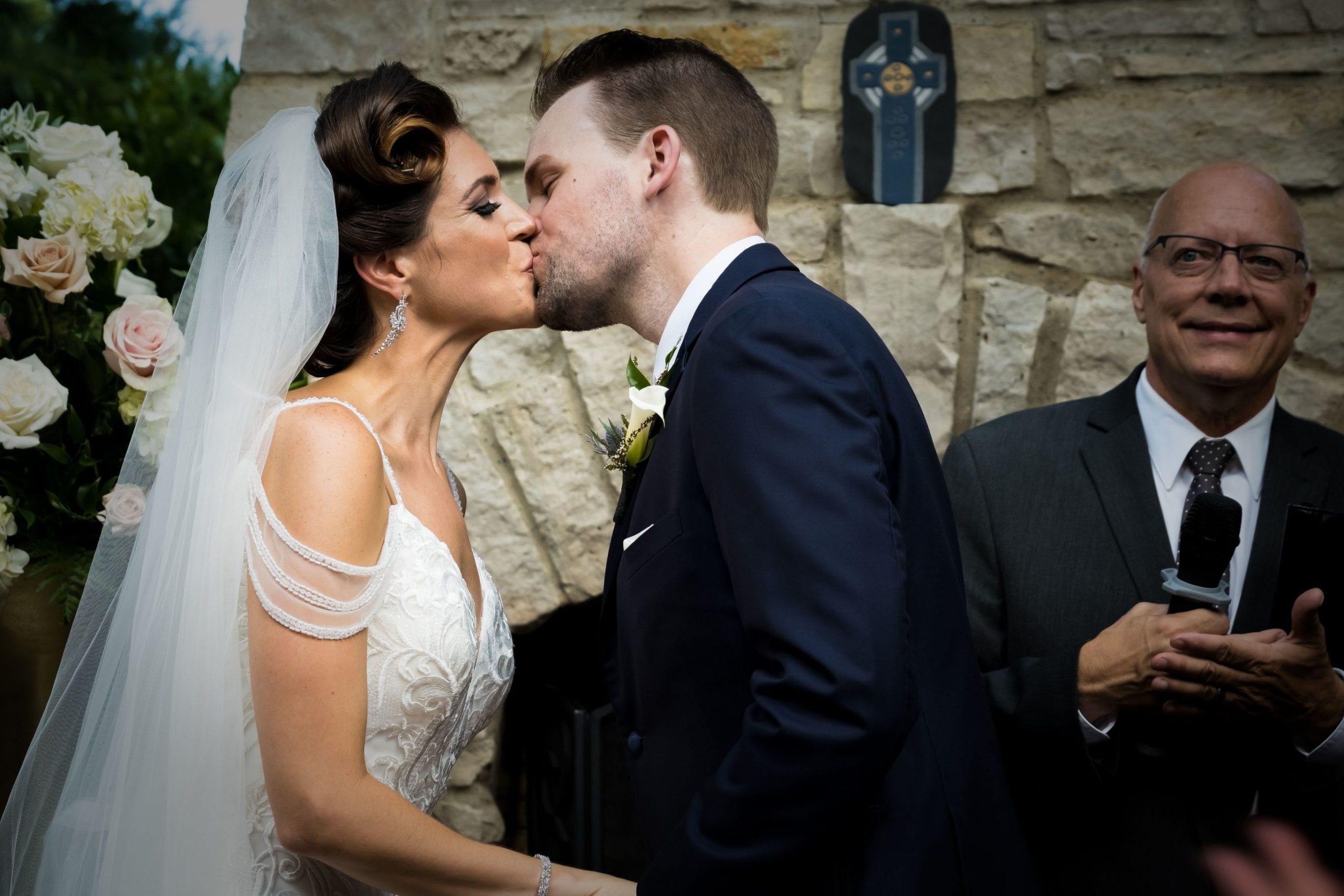 Ashley and Michael kissing at ceremony - Mike Staff Productions
