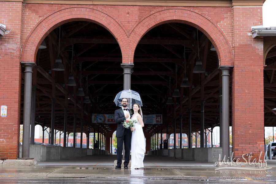 bride and groom eastern market rain - Mike Staff Productions Amanda and Michael's Detroit whiskey factory wedding