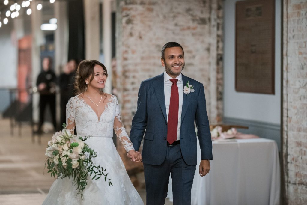 bride-and-groom-grand-entrance-at-Ford-Piquette-Avenue-Plant-min-scaled-1 - Mike Staff Productions - Mike Staff Productions downtown detroit wedding