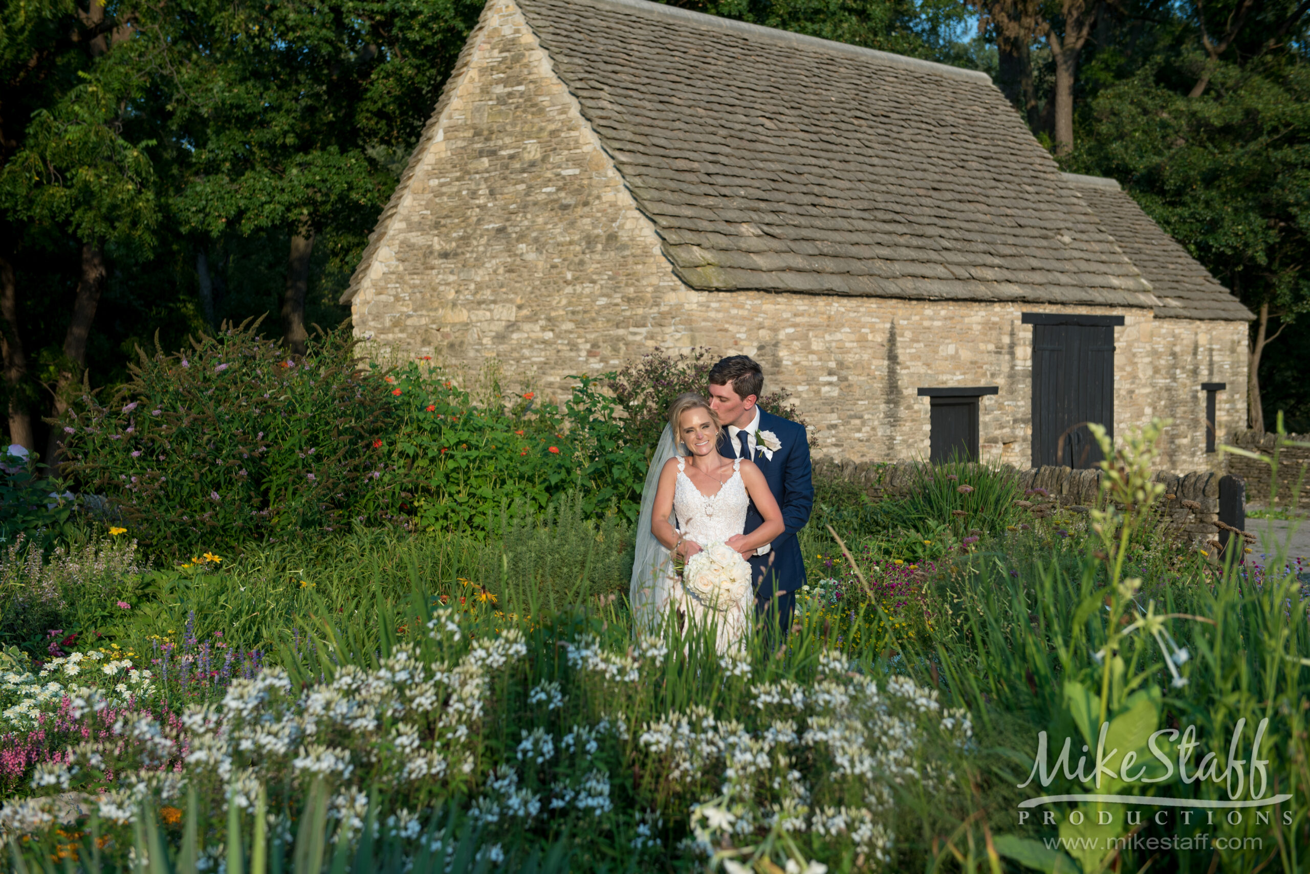 bride and groom in field - Mike Staff Productions bride and groom in field