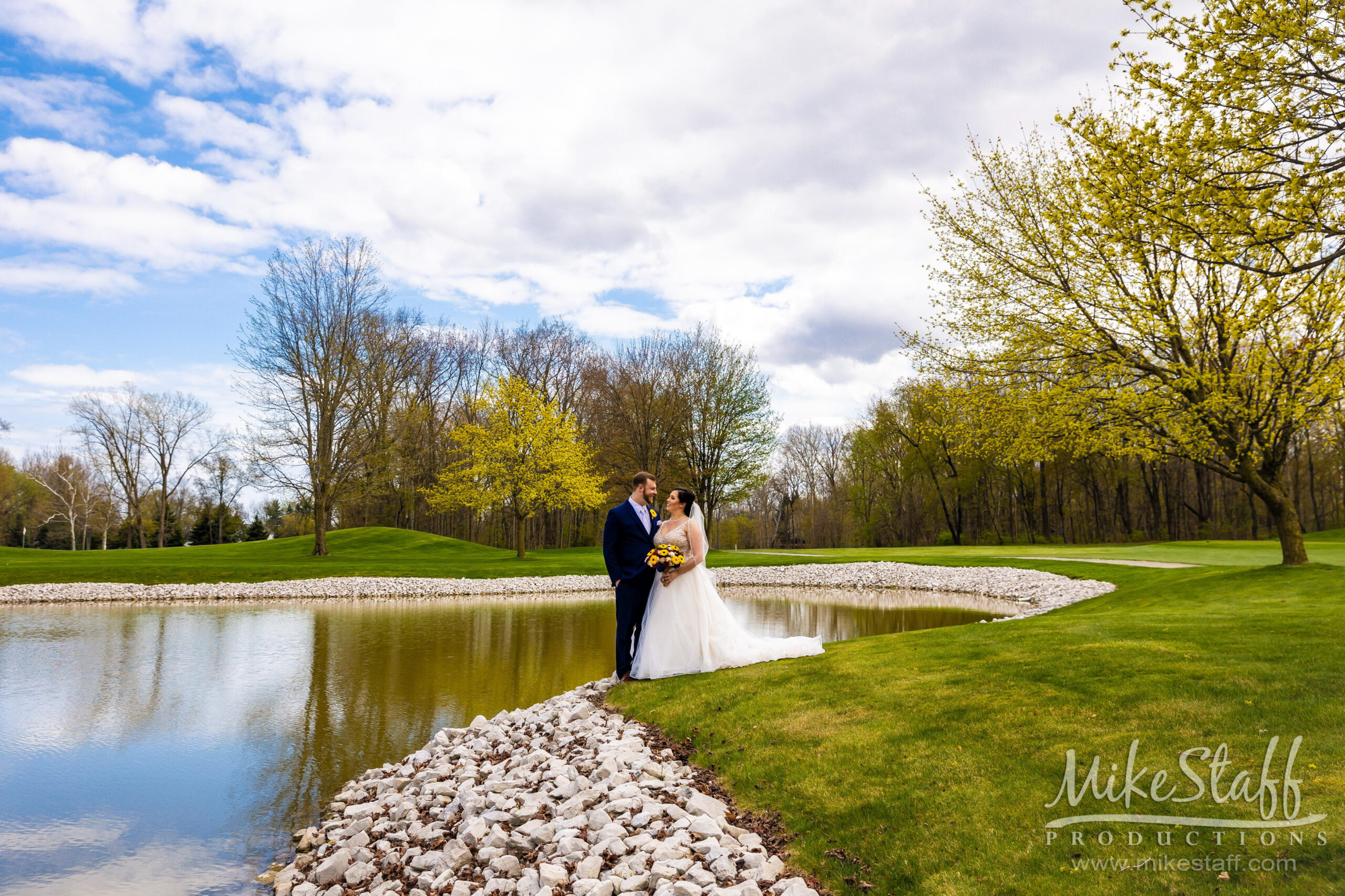 bride and groom in front of pond at sycamore hills - Mike Staff Productions bride and groom in front of pond at sycamore hills