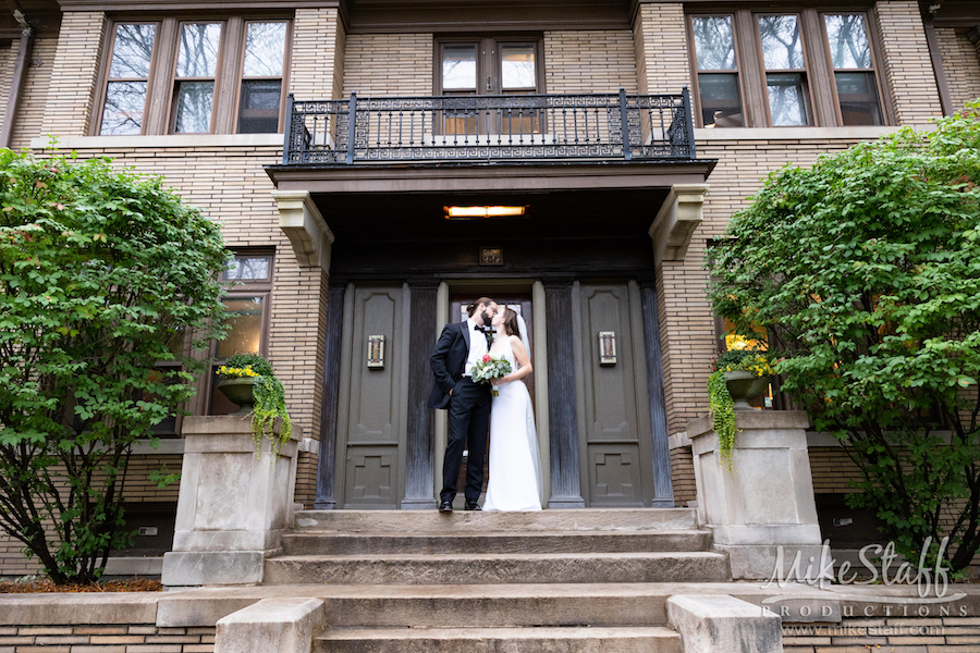 bride and groom outside doorway - Mike Staff Productions Amanda and Michael's Detroit whiskey factory wedding