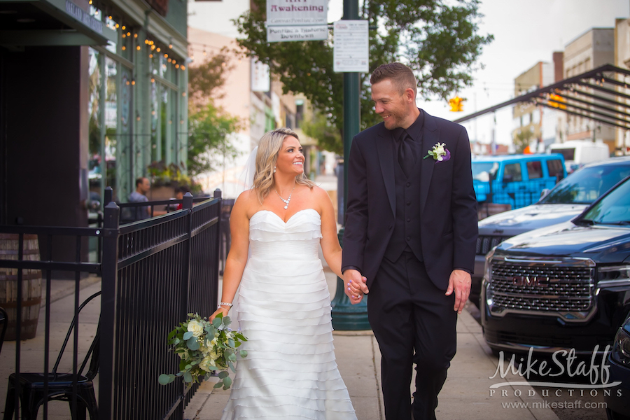 bride and groom walking in pontiac - Mike Staff Productions bride and groom walking in pontiac