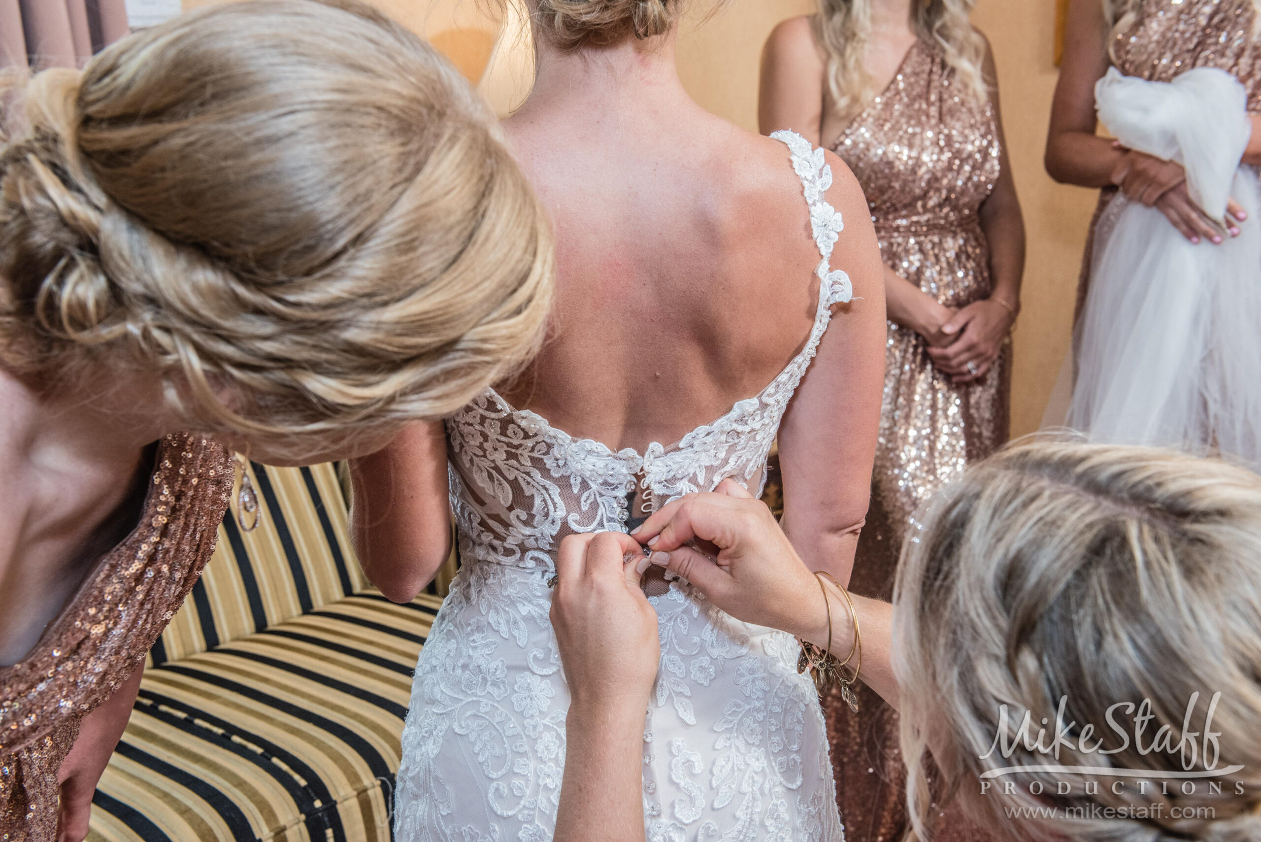 bride getting dress on - Mike Staff Productions bride getting dress on
