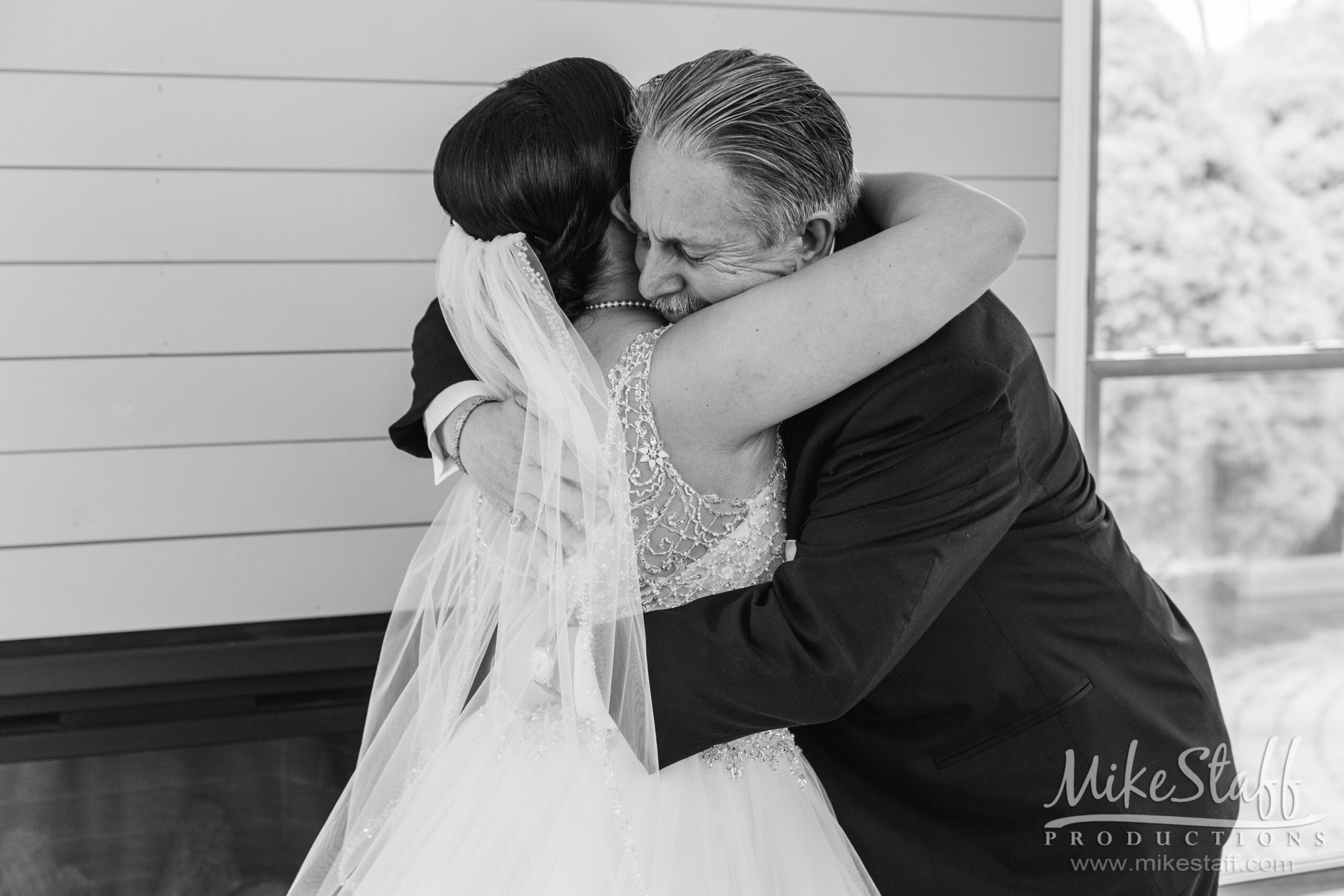 bride hugging dad - Mike Staff Productions bride hugging dad