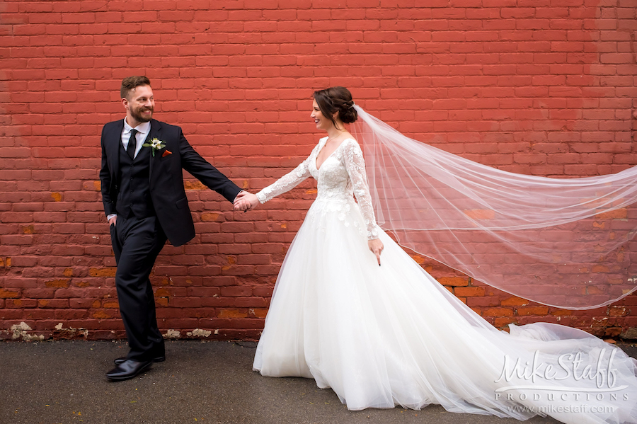 downtown holly bride and groom walking - Mike Staff Productions downtown holly bride and groom walking
