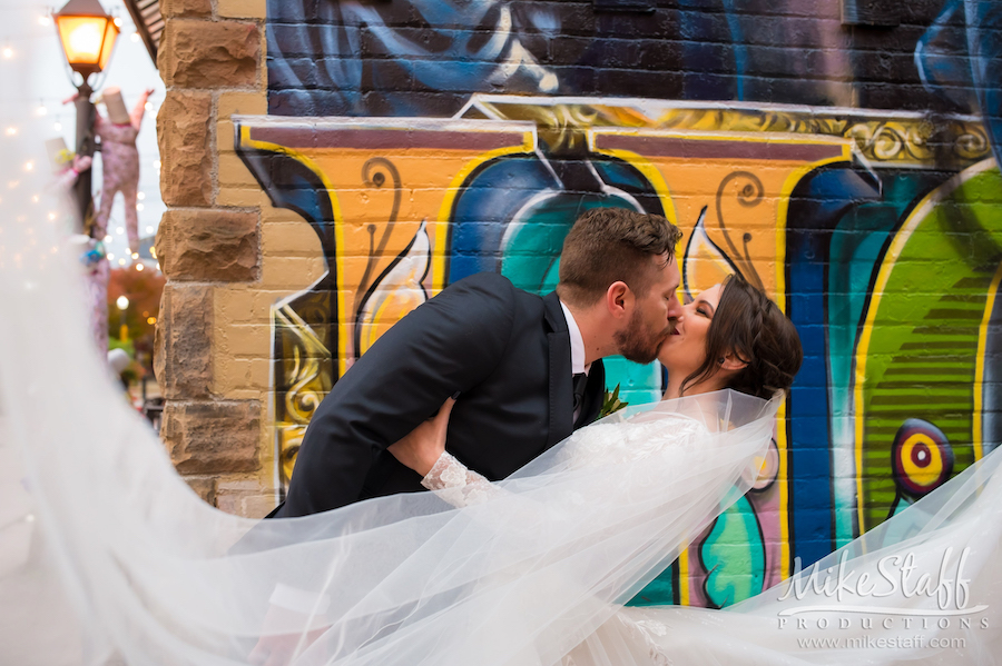 downtown holly graffiti groom dipping bride - Mike Staff Productions downtown holly graffiti groom dipping bride