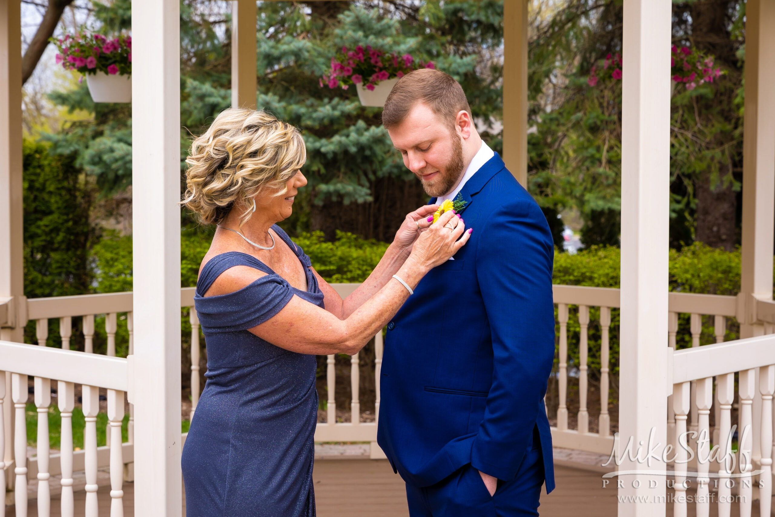groom and mother pinning boutineirre - Mike Staff Productions groom and mother pinning boutineirre