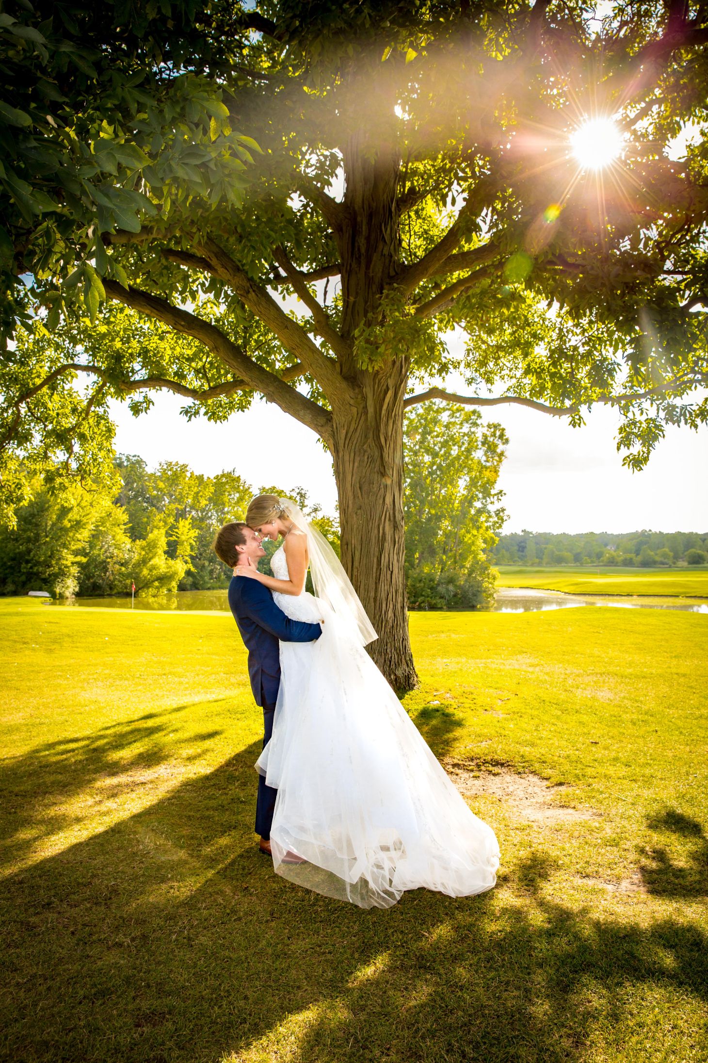 Isabelle & George romantic with sun shining down - Mike Staff Productions