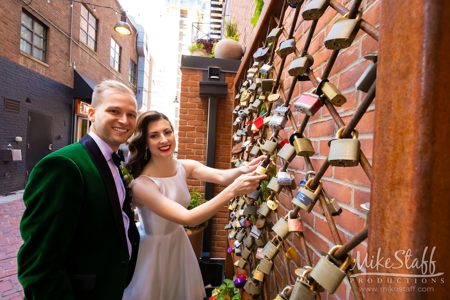 mikestaff-18 - Mike Staff Productions bride and groom placing lock in belt detroit