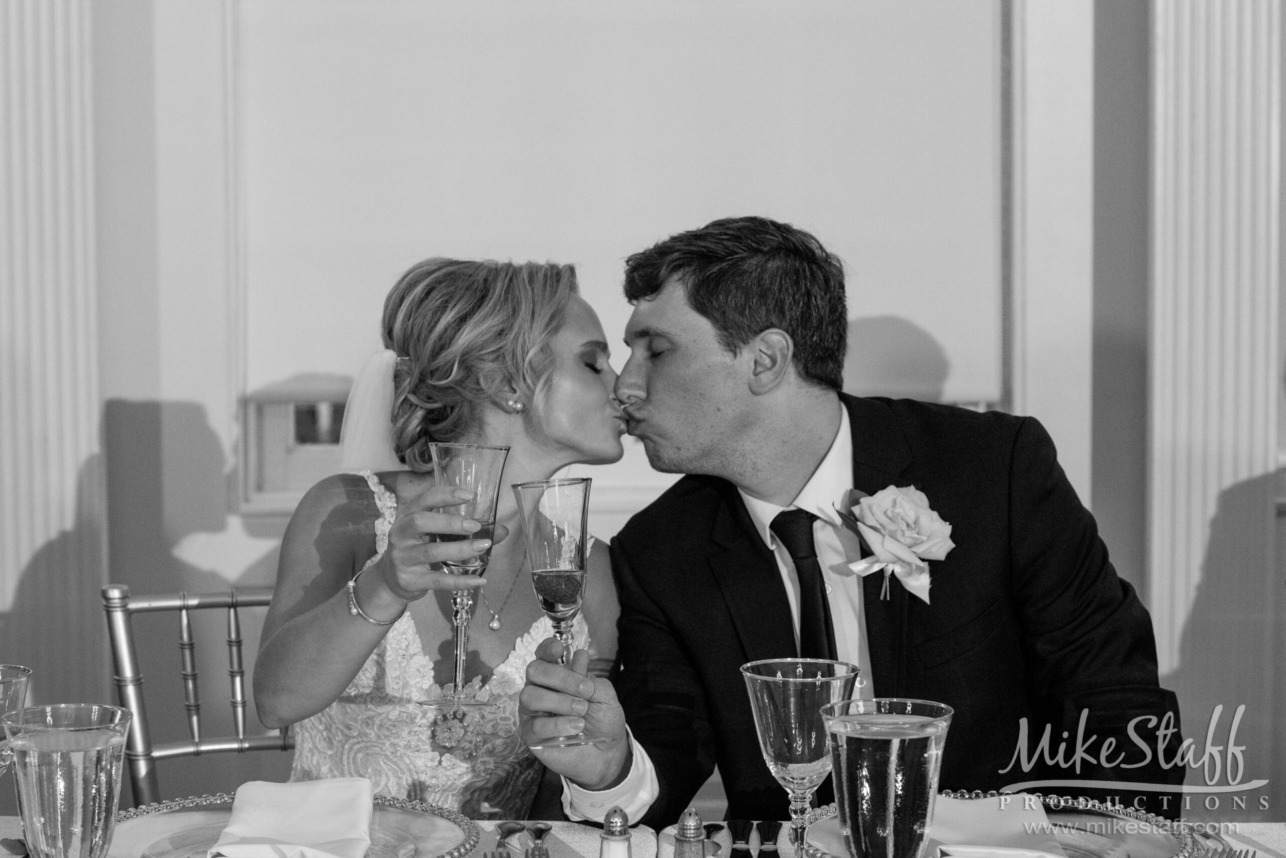 rebecca and kyle kissing at reception - Mike Staff Productions rebecca and kyle kissing at reception
