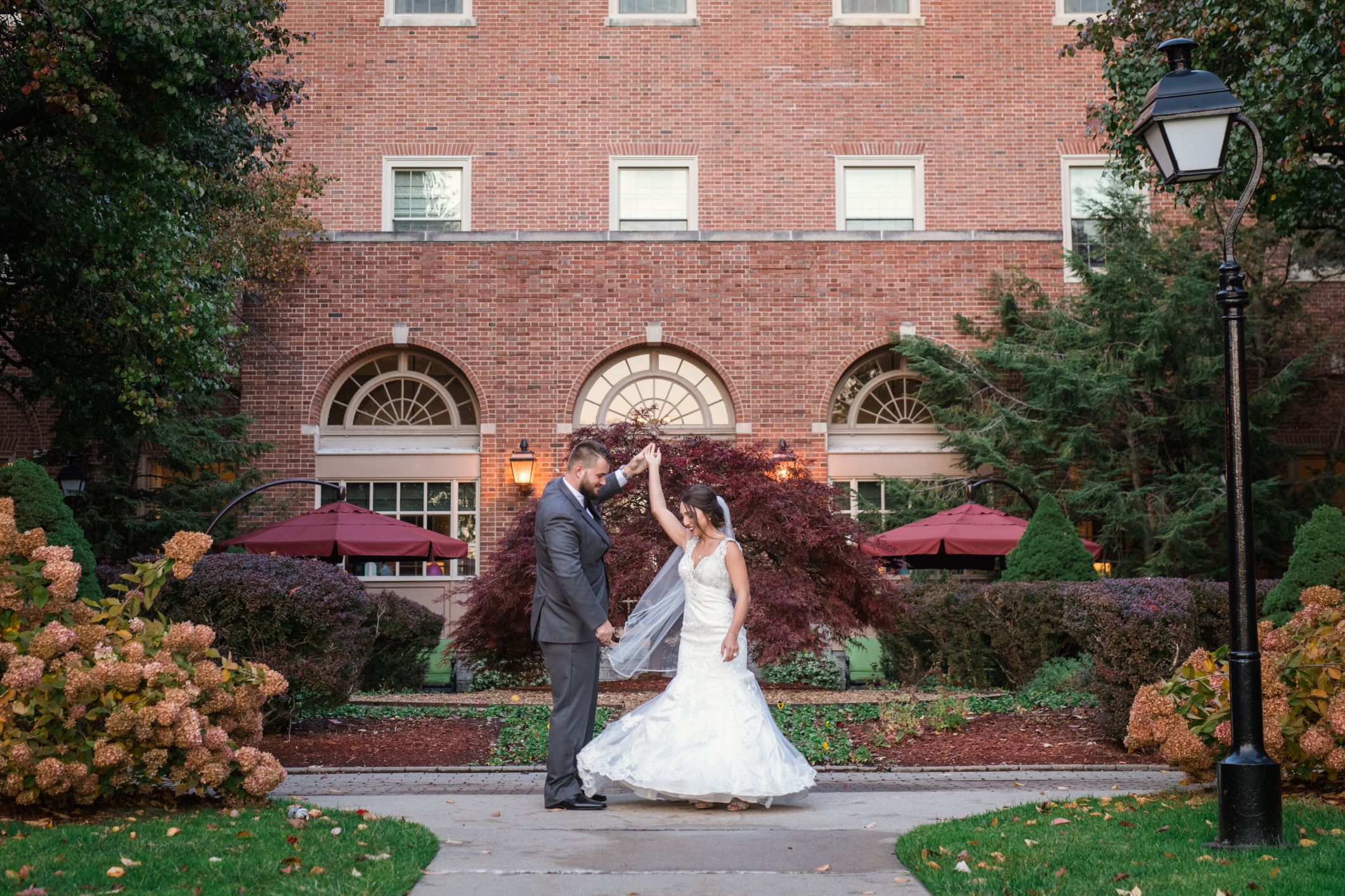 twirling bride outside dearborn inn - Mike Staff Productions dearborn michigan wedding